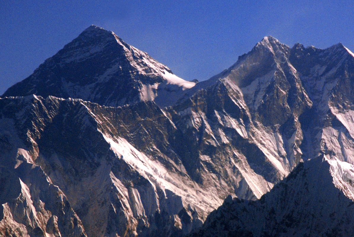 Kathmandu Mountain Flight 08-3 Everest And Lhotse Close Up Here is a close up of the summit of Mount Everest (8850m) and Lhotse from the Kathmandu mountain flight. From the Everest summit, the southeast ridge descends to the South Col and then rises again to the summit of Lhotse (8516m), the fourth highest mountain in the world. On the right are Lhotse Middle (8414m) and Lhotse Shar (8383m).